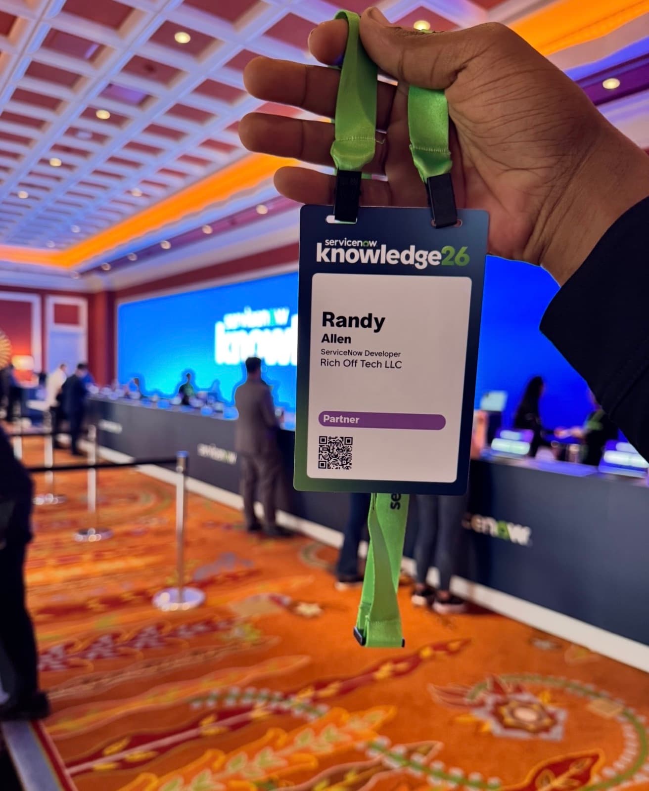 Randy Allen — K26 Partner badge held at the venue