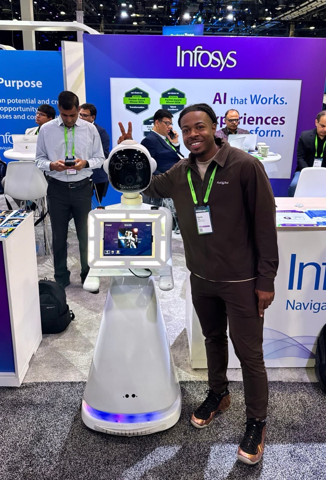 Bo at the Infosys booth, Knowledge 2026